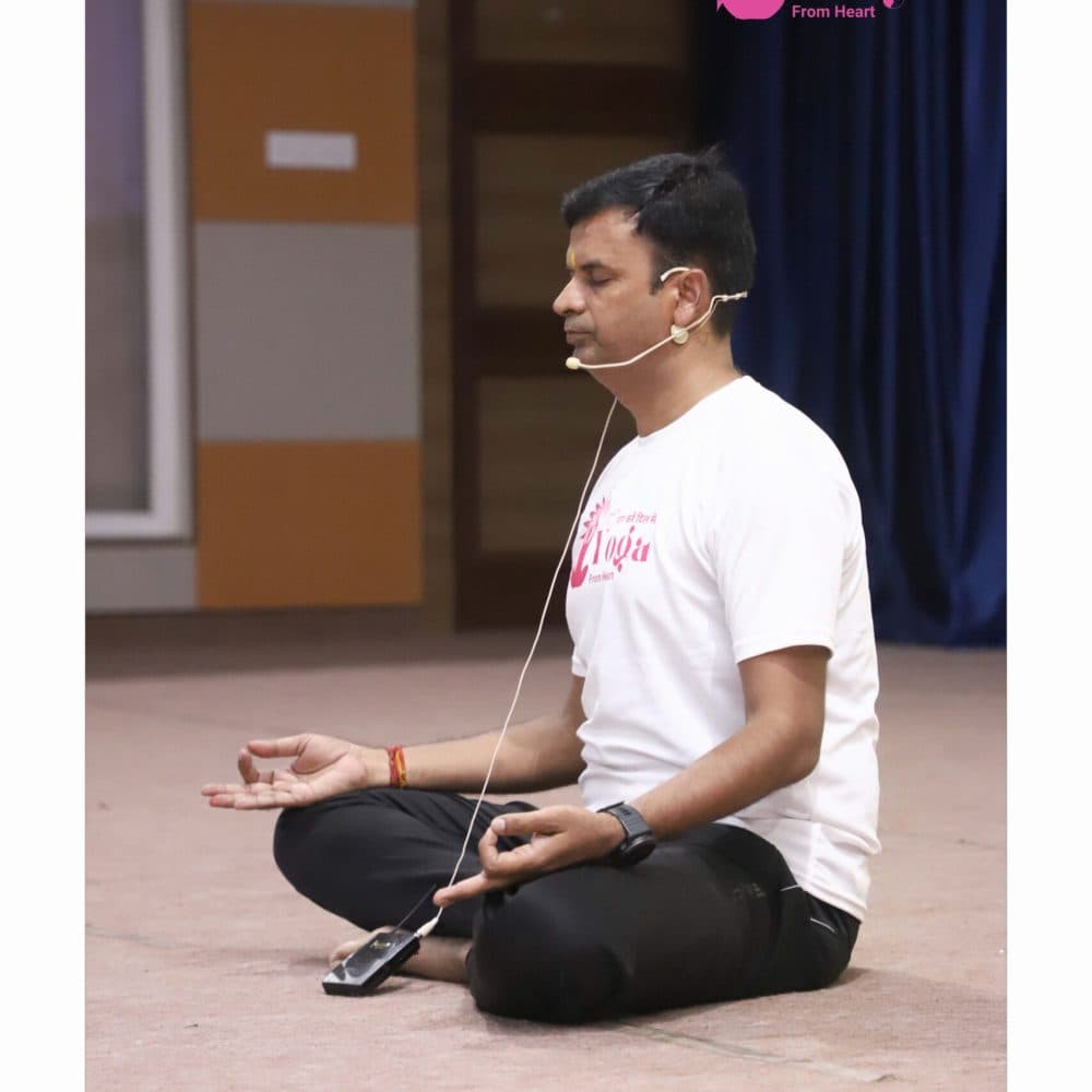Yogacharya Manish Jain leading a guided meditation session